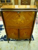A quality reproduction inlaid Kingwood drinks cabinet with shaped brass edged top, canted corners