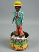 A tinplate model of a dancing man, battery operated (cannot guarantee working order) with on/off