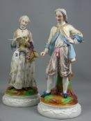 A large pair of Continental bisque porcelain figurines of a young woman in bodice and flowing