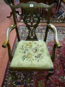 A 20th Century reproduction Chippendale mahogany child's armchair with pierced and carved