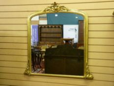 A Victorian gilt framed overmantel mirror with applied leaf decoration, 110 x 140 cms