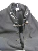 A North Wales police officer's cape issued 1959, white metal numbered to the collar G.149, the front