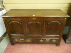 A well patinated 18th Century oak Lancashire style dower chest having three front shaped and fielded