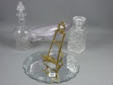 A Grace Darling pressed glass boat, a modern mirrored display mat, two glass decanters with stoppers