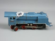 A gauge 0 electric locomotive with front lamp in blue livery named 'C S D Merkur' labelled to the