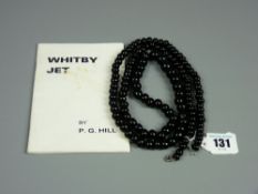 A 39 ins Whitby jet necklace of graduated beads, approximately 138 grms total weight with a