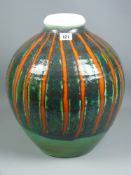 An impressive Poole pottery vase of globular form with segmented bands of green and orange, mid 20th