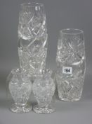 Two pairs of cut glass vases, 24 cms high the largest