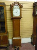 An early 19th Century mahogany longcase clock, the 12 ins arched top numbered dial with subsidiary