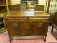 A 1930's oak two drawer, two door sideboard with mirrored back rail, 92 cms high plus back rail x