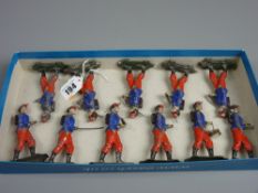 A group of eleven French tinplate toy soldiers, 9 cms high approximately (play worn condition, but