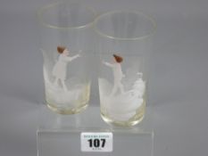 A pair of Mary Gregory decorated beakers depicting a young boy and girl, 10.5 cms high