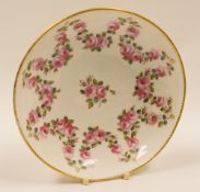 ATTRIBUTED TO NANTGARW PORCELAIN -  large saucer, finely painted with a pronged-garland of roses