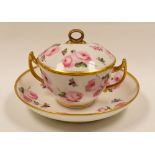 MANNER OF NANTGARW PORCELAIN - lidded and twin-handled chocolate cup and saucer with gilding and