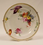 SWANSEA PORCELAIN - circular plate with sprays of interior flowers and with continuous gilt swirls