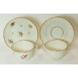 SWANSEA PORCELAIN - two cups and saucers, both moulded with basket-weave and swirls, one with simple