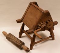 WELSH FARMHOUSE - hand-mechanised wooden oatcake cutter together with a wooden oatcake cutting-pin