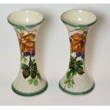 LLANELLY POTTERY - pair of waisted spill-vases painted in the rarely seen 'Blackberry' decoration,