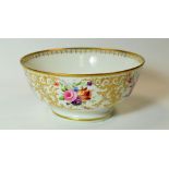 SWANSEA PORCELAIN - a footed tea bowl with all-round floral decoration, profusely gilded and with