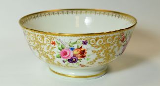 SWANSEA PORCELAIN - a footed tea bowl with all-round floral decoration, profusely gilded and with