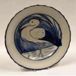 LLANELLY POTTERY - plate with crimped rim and painted with a standing heron or stork amongst