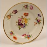 ATTRIBUTED TO SWANSEA PORCELAIN - circular plate with gilded rim and six sprays of colourful