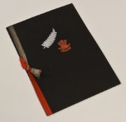 1935 WALES v NEW ZEALAND AFTER-MATCH DINNER MENU, EMBOSSED WITH BOTH CRESTS TO THE COVER
