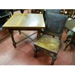 An oak barley twist draw leaf table with cross stretcher along with a pair of oak chairs on carved