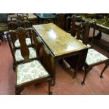 A 19th Century mahogany dining table having large twin flap leaves and central gate supports on
