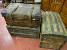 An antique leather steamer trunk marked 'W B M, Stoke-on-Trent' to the top and two further dome