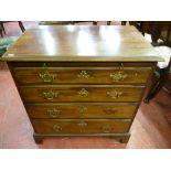 A 19th Century mahogany bachelor's chest of four graduating oak lined drawers with brushing slide,