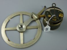 A drum cased pocket sextant by Stanley of London, 8 cms diameter and a steel four spoke circular