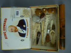 A collection of antique and vintage sewing items to include a mauchline ware needle case and thimble