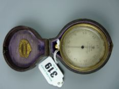 A gilt brass 19th Century pocket barometer with revolving bezel, the silvered dial marked 'Husbands,