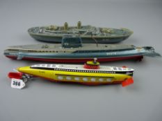 Toys - three sea vessels, a Schuco electro submarine, 34 cms long, a battleship labelled 'Forest