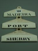 Three semi-glazed pottery bin labels marked 'Madeira', 'Port' and 'Sherry', impressed ciphers to the