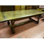 A good sized reproduction oak refectory table on turned block supports with substantial stretchers