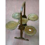An Edwardian mahogany monoplane multi-tray folding cakestand with attached patent label