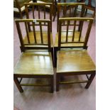 A set of four antique oak farmhouse chairs with reeded spindle backs