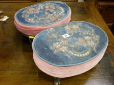 A pair of Victorian oval walnut footstools with beadwork tops