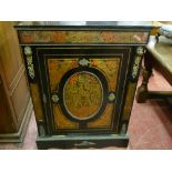 An ebonized and red Boulle single door side cabinet circa 1870 with ormolu mounts and velvet lined