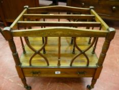 An Edwardian inlaid rosewood Canterbury with crossbanded base drawer on turned supports with brass