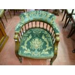 An Edwardian salon tub armchair, upholstered in a green floral plush upholstery, 70 x 62 x 59 cms