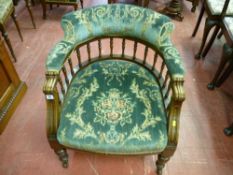 An Edwardian salon tub armchair, upholstered in a green floral plush upholstery, 70 x 62 x 59 cms