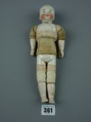 Toys - a Motschmann Sonnerburg Taufling type doll, male painted porcelain face, (chest damaged),