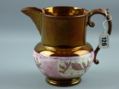 A copper lustre jug with pink lustre band