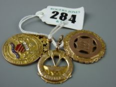 Three nine carat gold trophy pendants, total 24 grms