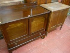 An Edwardian mahogany railback bedroom cabinet with twin front panel doors over a single base drawer