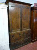 A two piece Victorian mahogany press cupboard, deep cornice over two full panelled doors on a