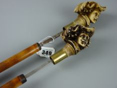 Two near square bladed bamboo sword sticks with resin cast heads of cavaliers forming the handles (